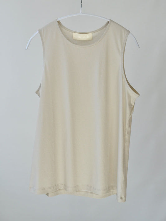 Front of Aniset Top in Soft Beige on a hanger