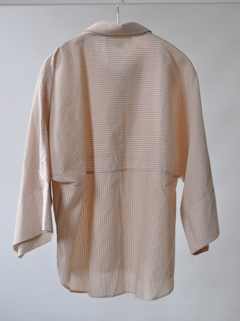 Back of Emma shirt in beige stripes