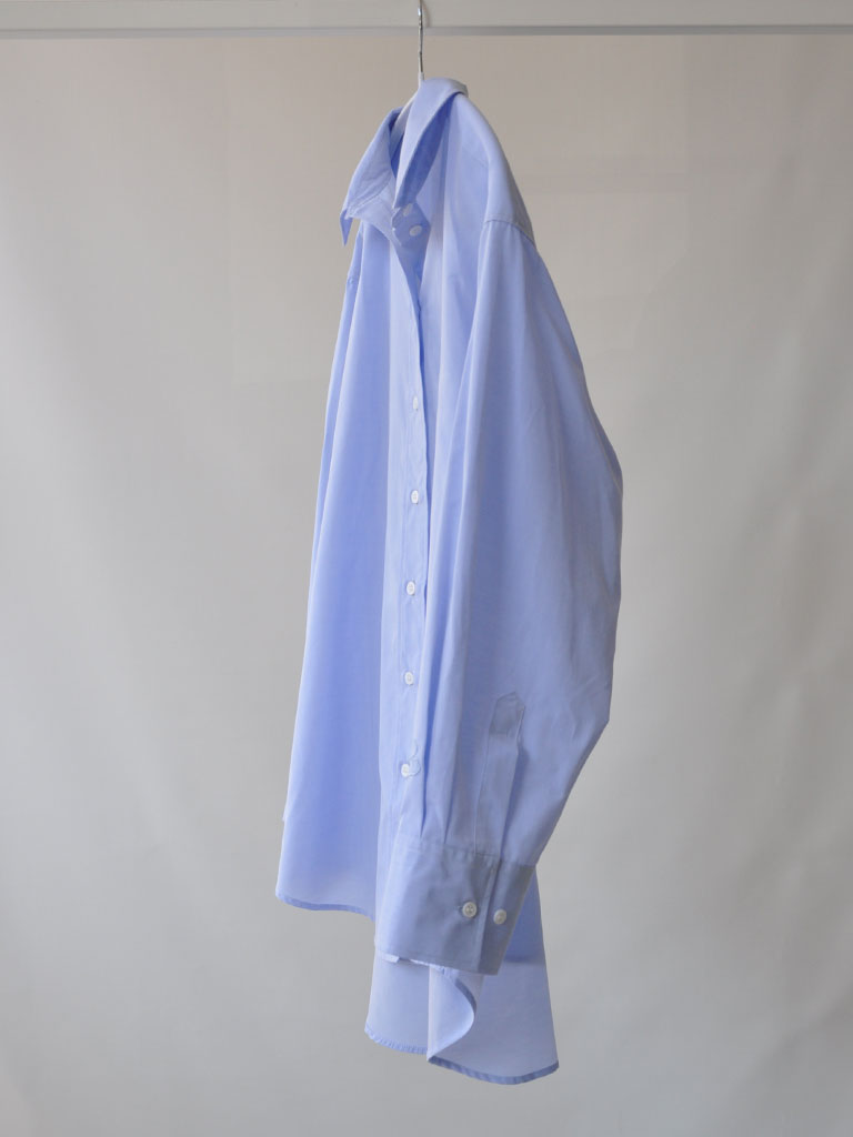 Side of Bea Shirt in Blue on a hanger