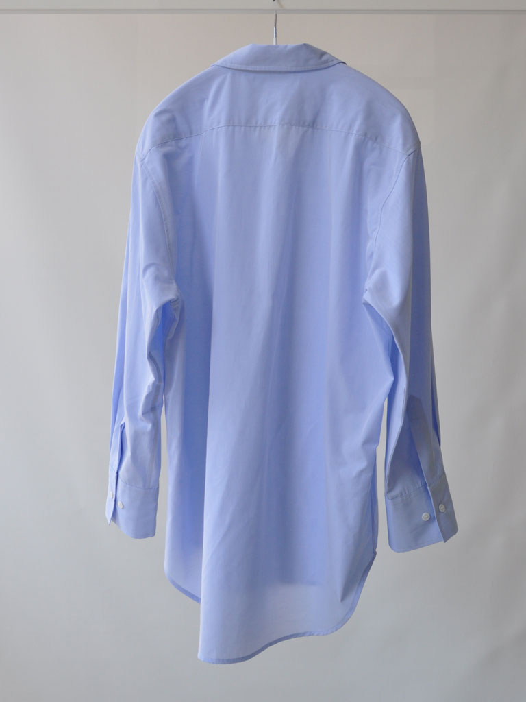 Back of Bea Shirt in Blue on a hanger