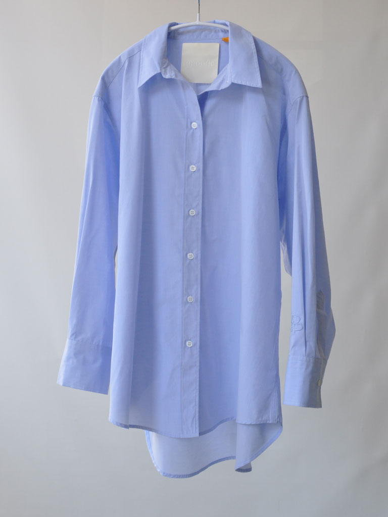 Front of Bea Shirt in Blue on a hanger