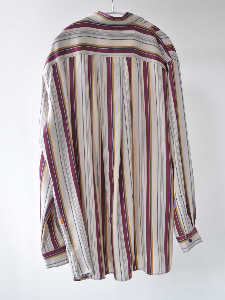 Back of Ana Sat Shirt in Magenta Stripes on a hanger