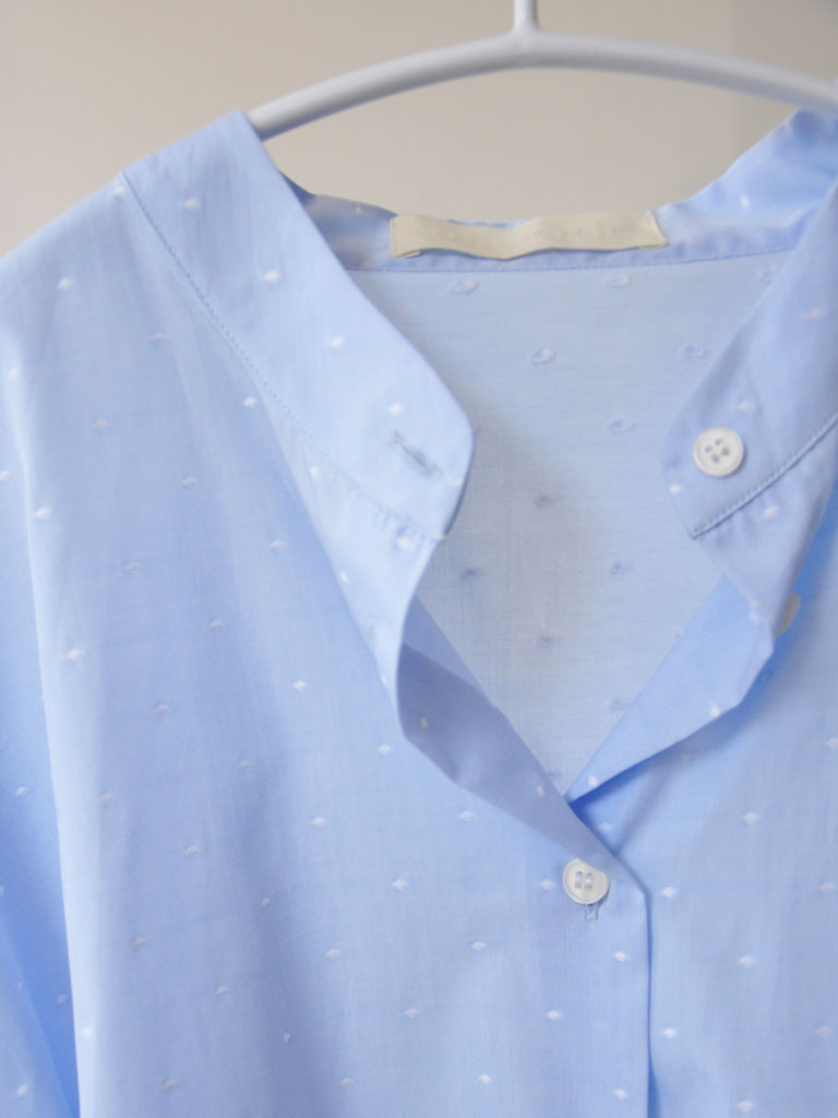 Collar Closeup of Aude Shirt in Blue on a hanger