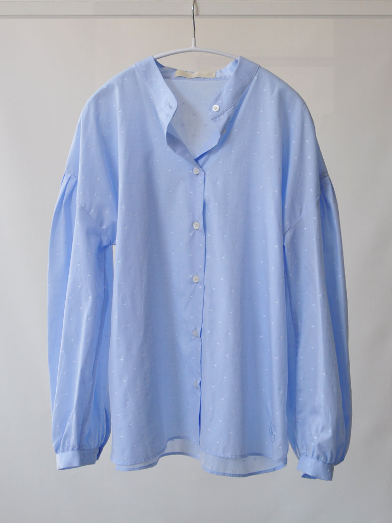 Front of Aude Shirt in Blue on a hanger