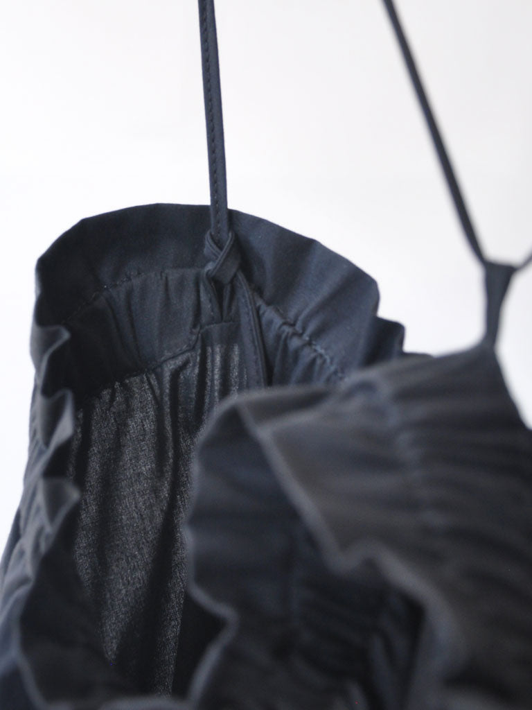 Strap Detail Closeup of Carmen Skirt Dress in Black on a hanger