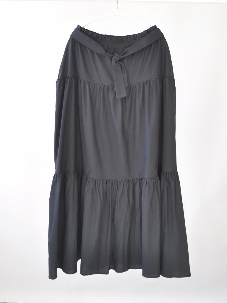 Front of Carmen Skirt Dress in Black on a hanger