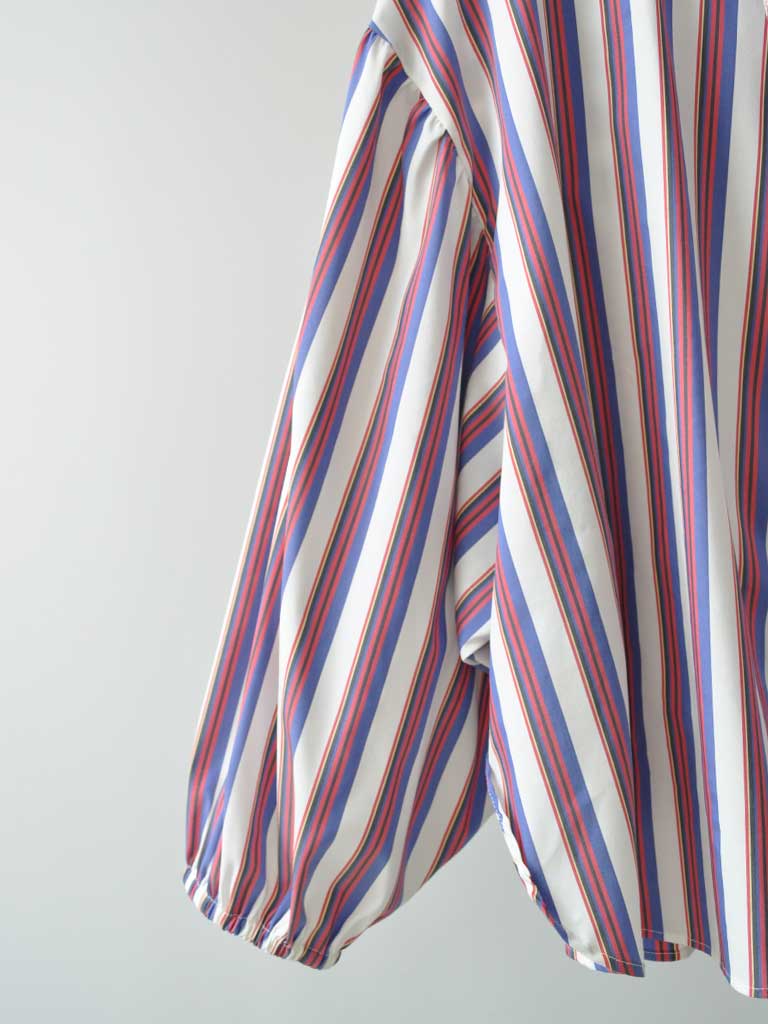 Sleeve Closeup of Elli Shirt in Magenta Stripes on a hanger