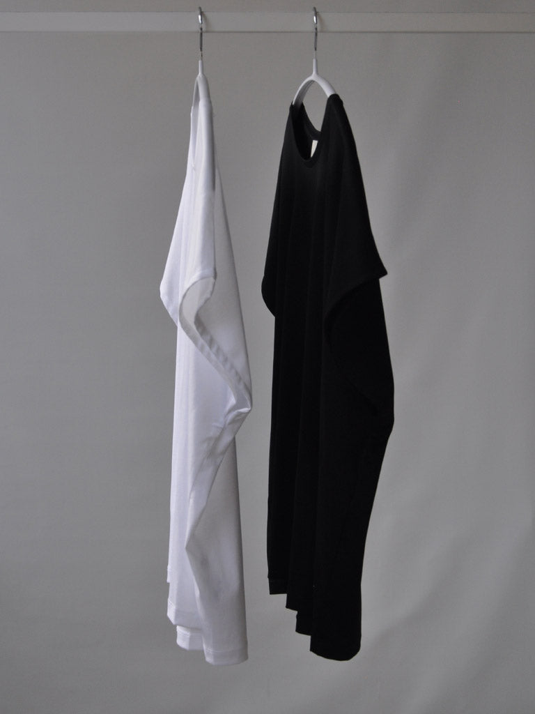 Side of Ovio Tee in White on a hanger