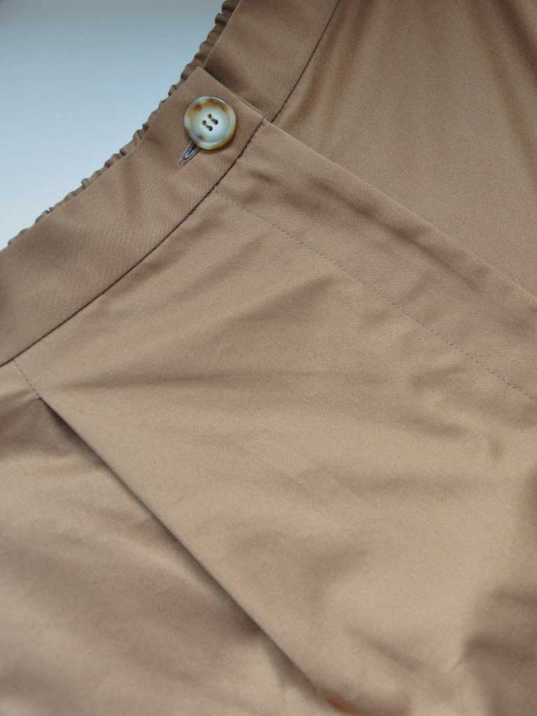 Button Closeup of Studio Pleats Pants in Brown