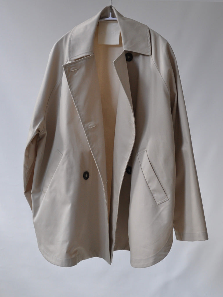 Front of Tea Trench Jacket in Beige on a hanger