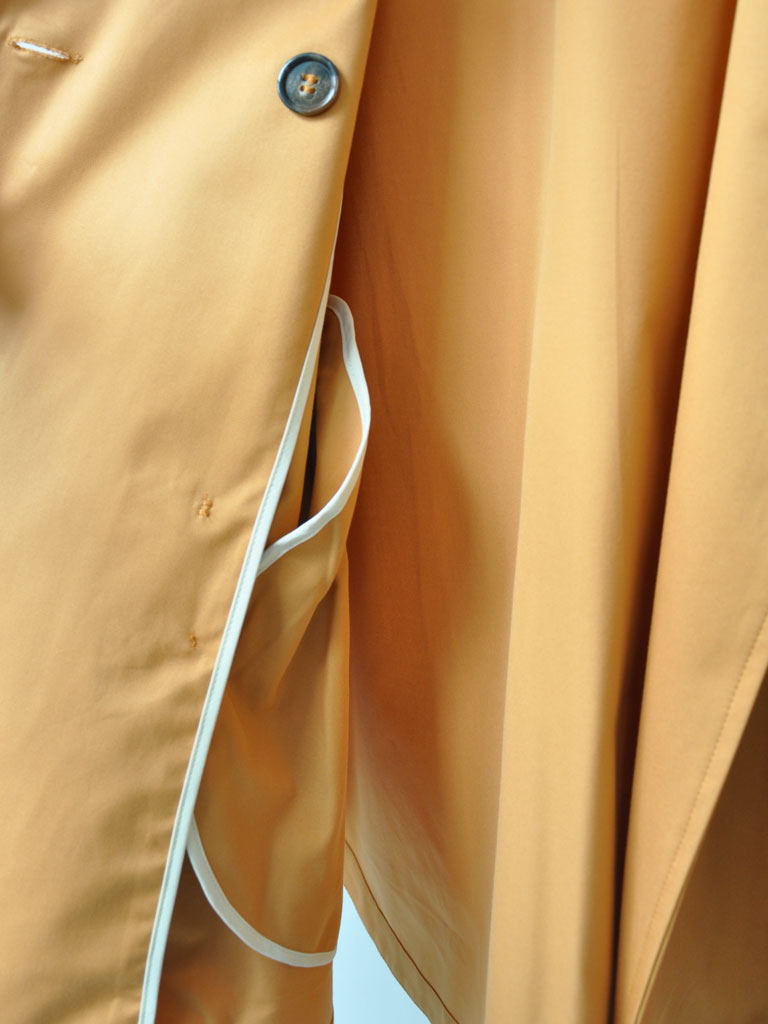 Inside Detail Shot of Tea Trench Jacket in Burnt Orange