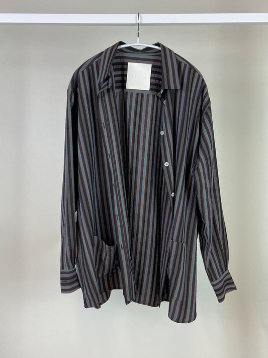 Anza shirt in muted brown stripes on a hanger