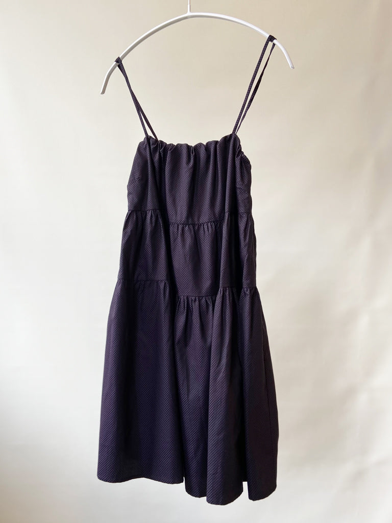 Front of Astis dress in black and purple check