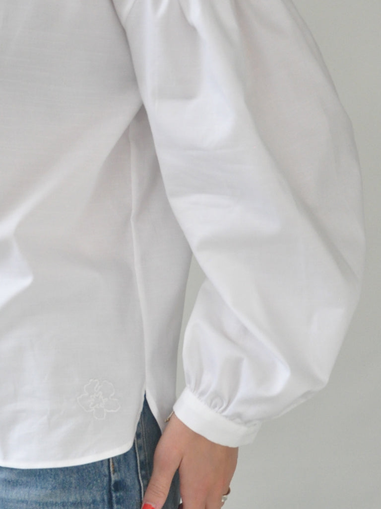 Sleeve closeup of Aude shirt in white