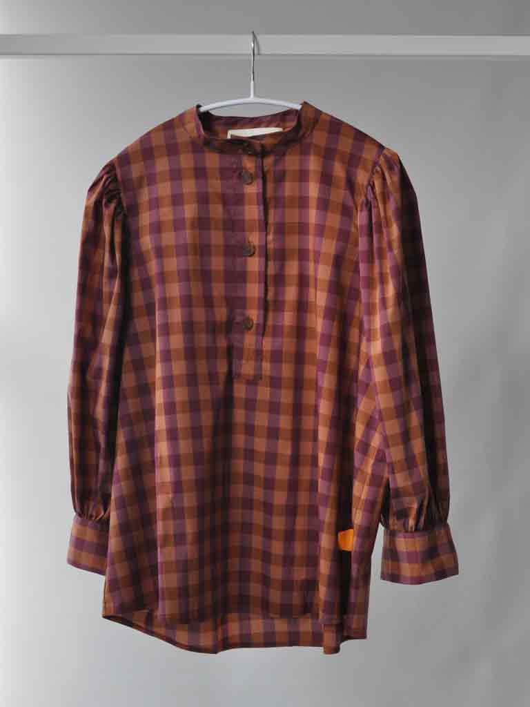 Front of Ave shirt in plum check on hanger