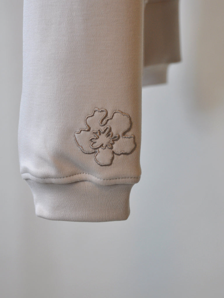 Sleeve closeup of Ayla Sweat in soft offwhite