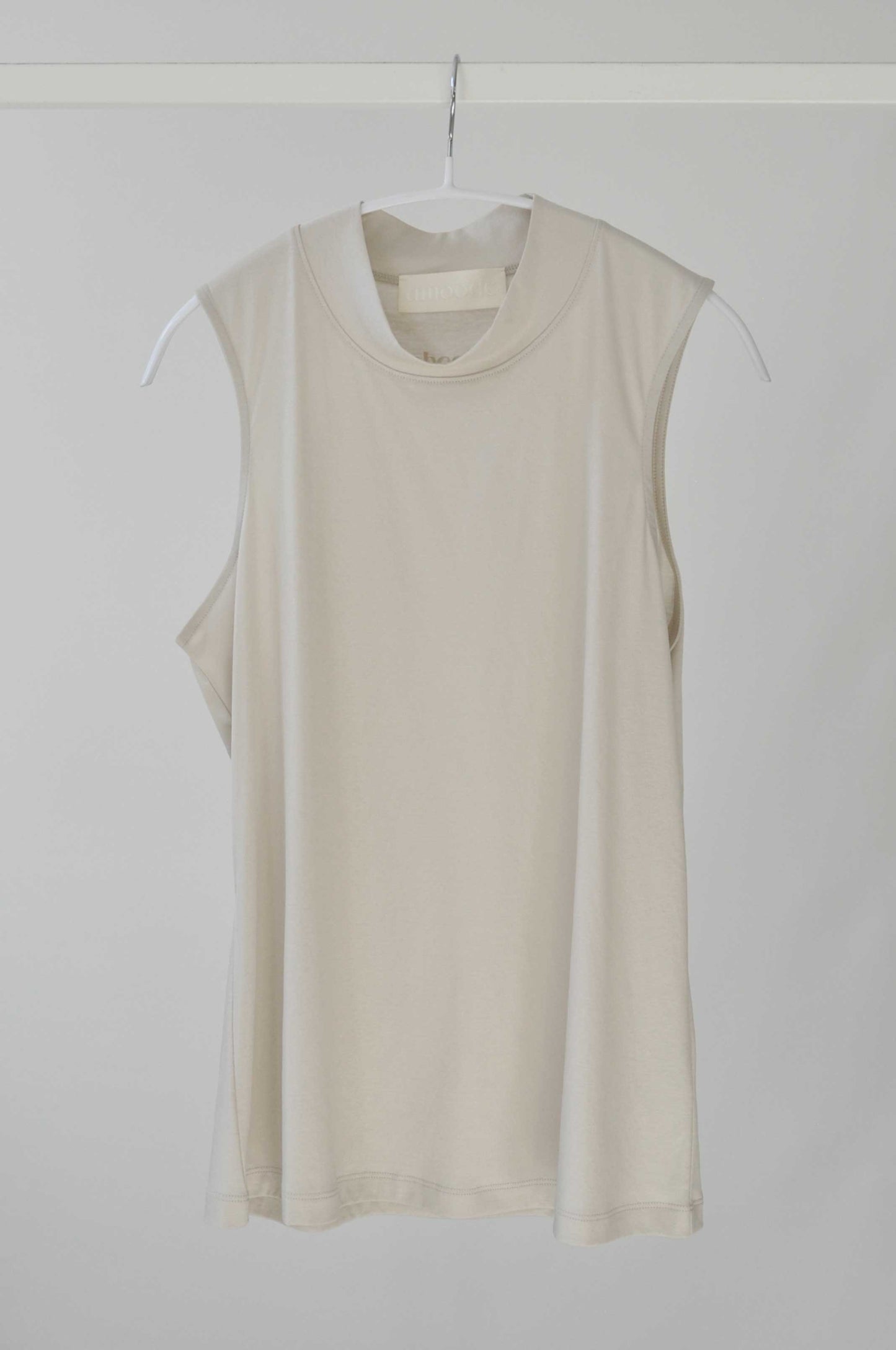 Front of Alanis Top in Soft Beige on a hanger