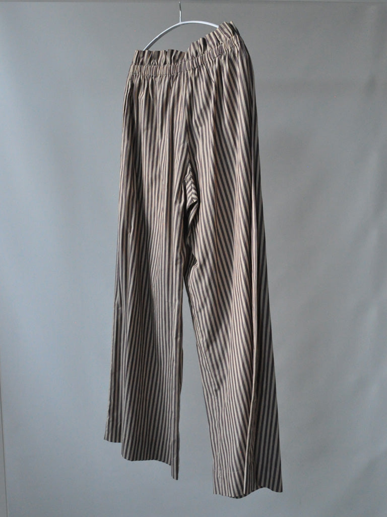 Back of Ami Pants in Stripes on a hanger