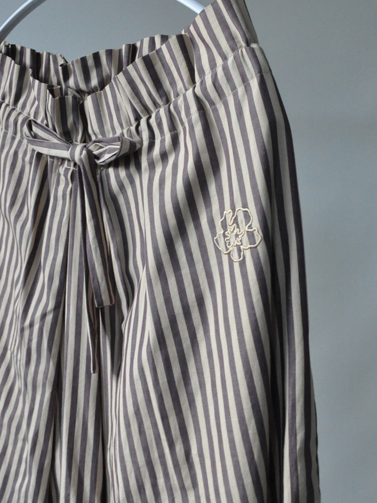 Side Closeup of Ami Pants in Stripes with Embroidered Flower