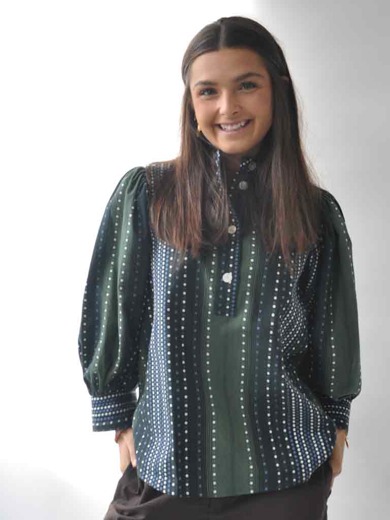 Front of Ava shirt in green with dots
