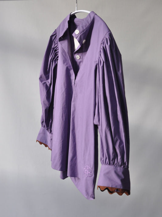 Side of Ava Shirt in Purple on a hanger