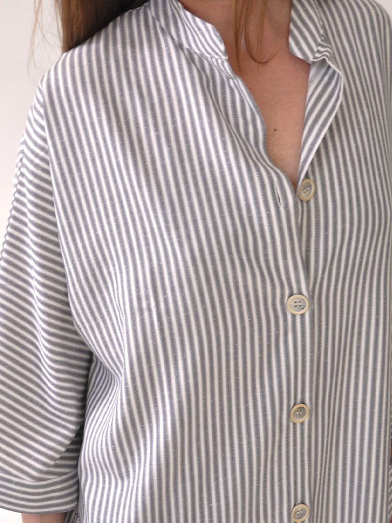 Collar closeup of Elisabeth kaftan dress in grey stripes