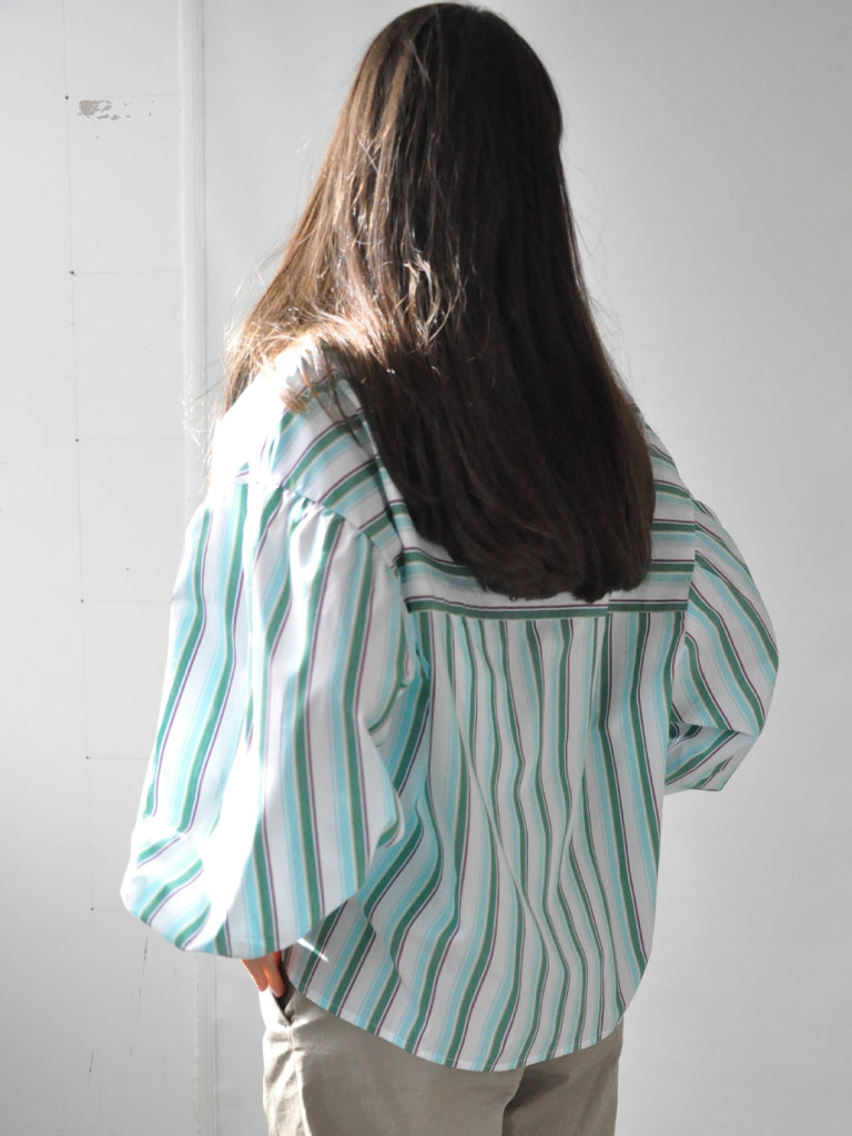 Back of Elli shirt in green stripes