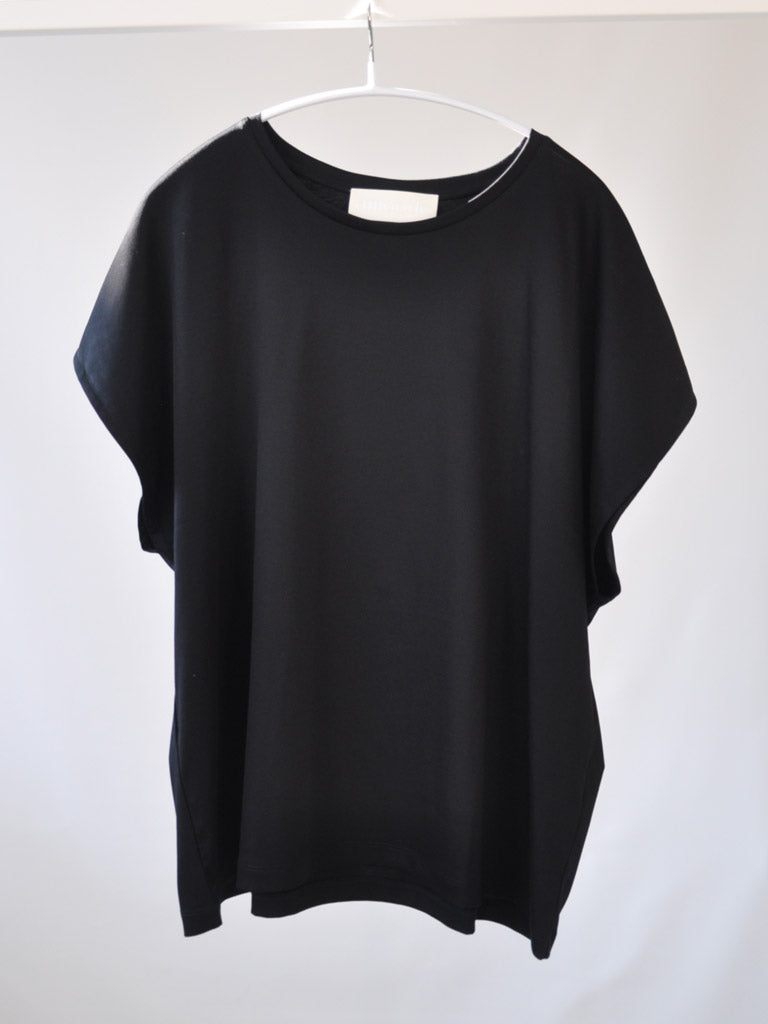 Front of Ovio Tee in Black on a hanger