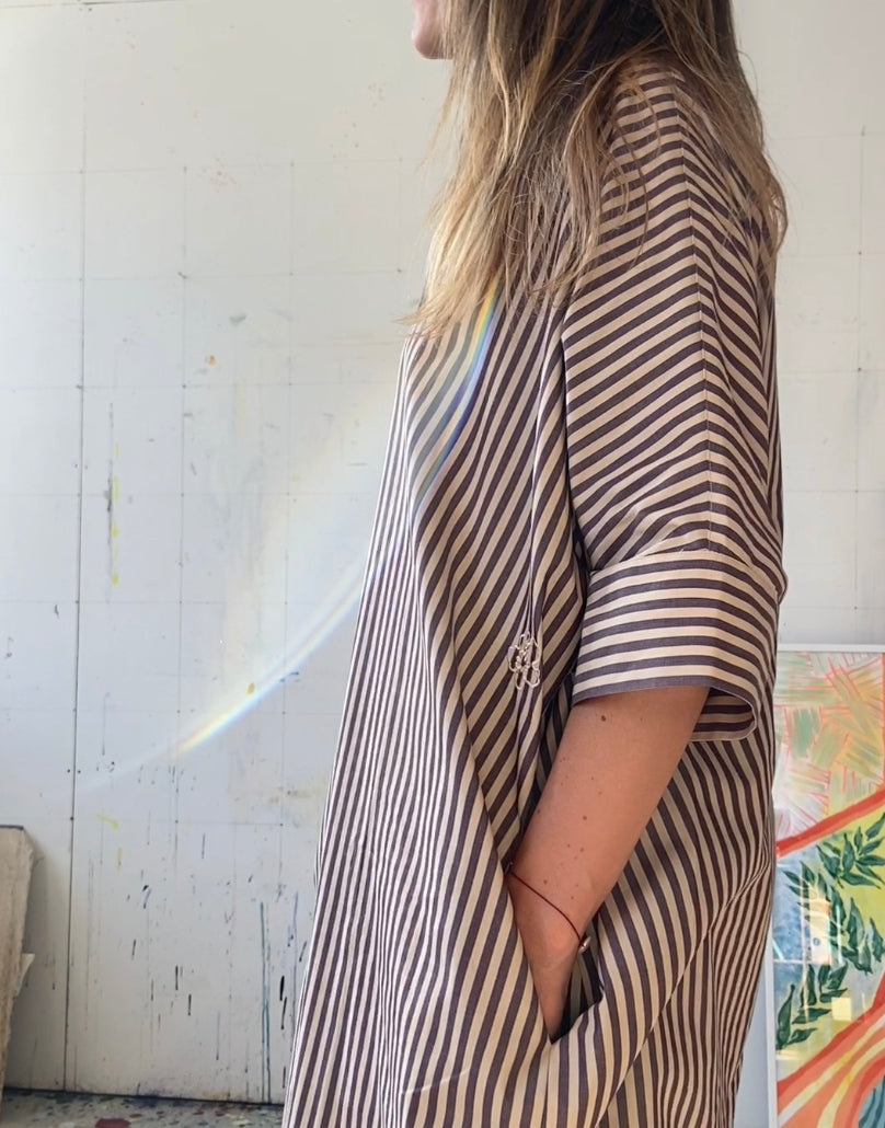 Side of beige and aubergine striped dress with pockets