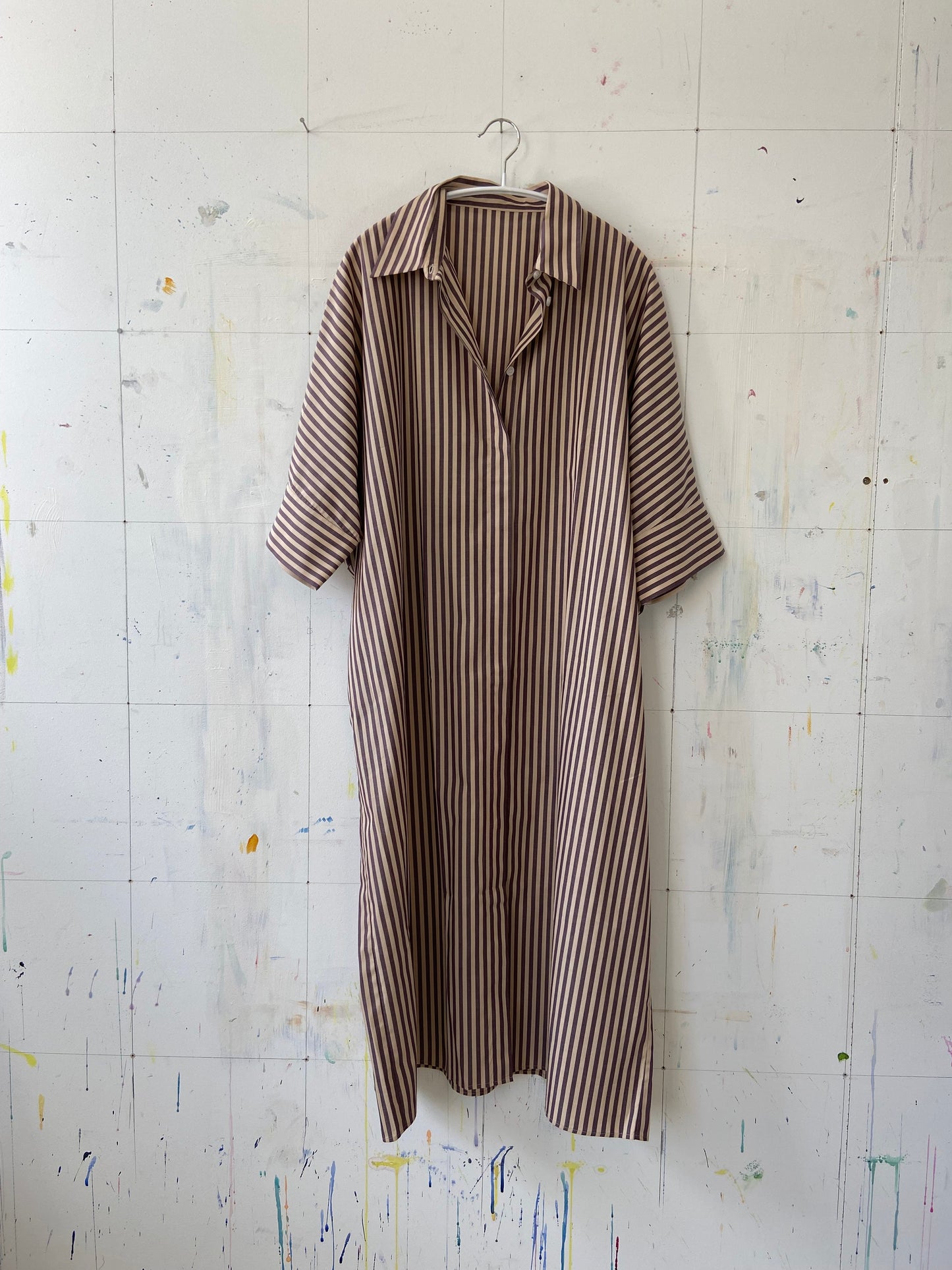 Front of beige and aubergine striped dress
